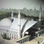 An architectural model of a modern building with elements of islamic design, featuring domes and minarets.