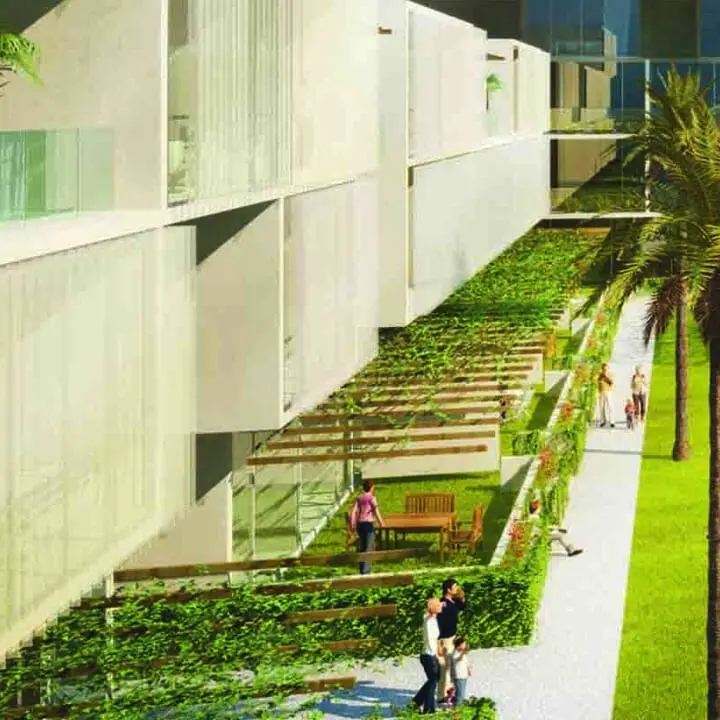 A modern residential building featuring a communal outdoor area with a swimming pool, greenery, and individuals engaged in various activities.